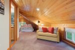 Cozy carpeted floors on the loft add to the feeling of warmth